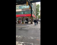 Man balance trash can on head then ride bike