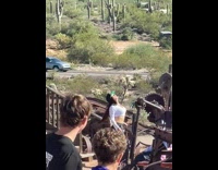 Woman in white crop top tiktok dance at the Ghost Town Part 2