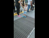 Boy holds a toy along the street in NY 