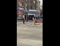 Girl walks with traffic cones on feet 