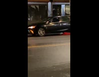 Undercover cop pulls over black sedan cab 