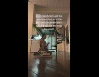 Woman no furniture eat pizza on floor