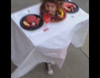 Kid dress up as food in table 