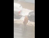 Person wear flip flops cross street and snow