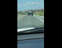 Two men woody buzz lightyear toy story costume trunk of car