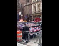 Cybertruck parked on street with Trump graffiti 