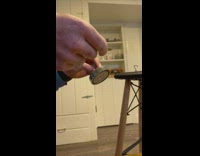 Paper money shown to be magnetic and sticks to the magnet