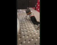 Guy slips and falls on wet bathroom floor