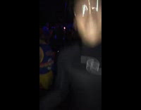 Guy with glasses at music rave event in full swim body suit