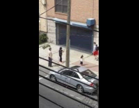 White jacket little girl sidewalk stick 