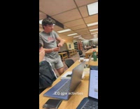 Guys in library smelling bottle salt 