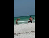 Blonde woman bikini  jump poses at beach