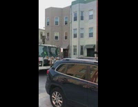 White garbage truck honks turkey SUV car 