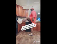 Guy opens oven door with foot splits 