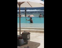 Girl wears tiara in pool for photo