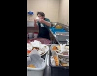 Employee working fast cleaning plates 