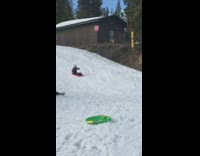 Girl on red sled crashes into boy 