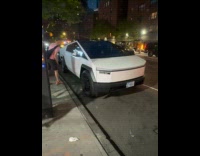 Guy spits at cybertruck parked on street