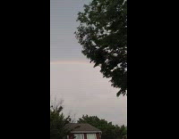Double rainbow grey sky parking lot guy