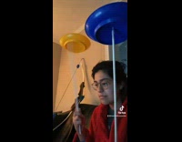 Collab BitchMP - Girl in red jacket spinning plates on sticks