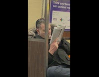 Man sucks the lid of a white out bottle 