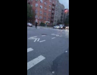 Guy yells and dances in the middle of intersection 