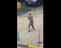Man in grey shirt boxing moves alone