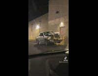 Silver truck after accident runs into yellow rail abandoned 