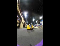 Guy wearing blue shorts falls on pad 