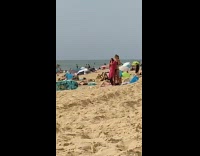 Collab Kook Of The Day - Girl helps friend take pink wetsuit off 