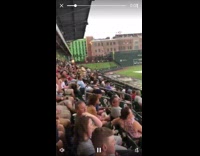 Guy running across field slips and falls 