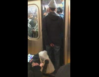 Man with rolling backpack blocks doors from closing on subway train