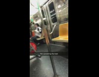 Man rides indoor exercise bike on subway train