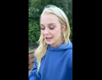 Woman grilling opens lid and steak is on fire