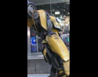 Realistic bumblebee transformers costume walking down street yellow