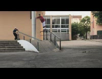 Guy falls onto ground when attempting scooter trick