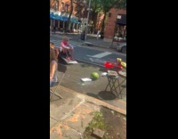 Group sets up picnic at the street