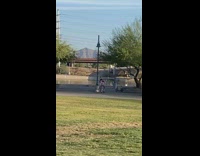 Black shoes girl dances phone tripod asphalt 