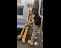 Person figure made of carton inside subway