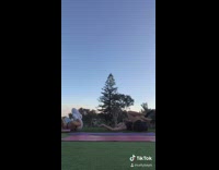 Black sports bra girl falls on friend 