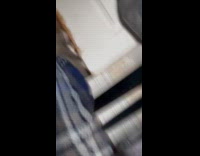 Car peeking underneath gap of bedroom door 