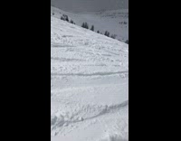 Snowboarder falls down slope and scorpions in the snow