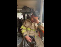 Tired firefighters ride sleep in the firetruck 
