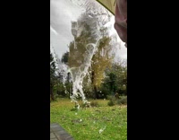 Water splashed down from tent in slow motion