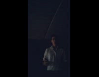 Man Harmonizes Voice Inside Hollow Tunnel at Night