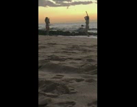 Girl bikini dance raise arms beach sunset