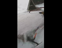 Skier grinds a rail and flies into safety net 