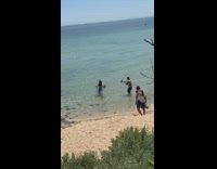 Woman bikini blue beach blanket seashore video shoot