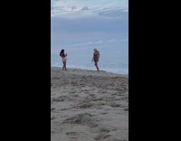 Striped blue romper girl beach guy backflip 