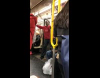 Man yells in front of subway train entrance doors